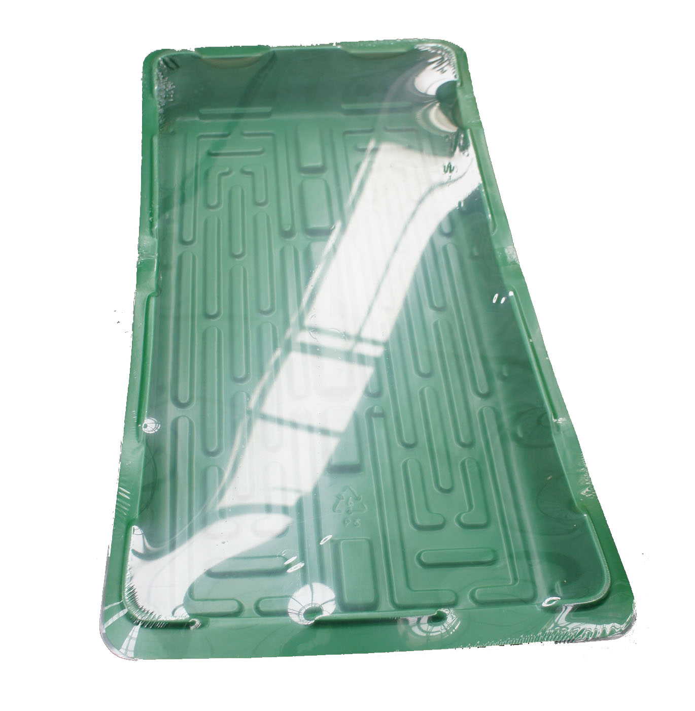 Een groene kunststof zaaibak met drainagegaten en ribbels op de bodem.