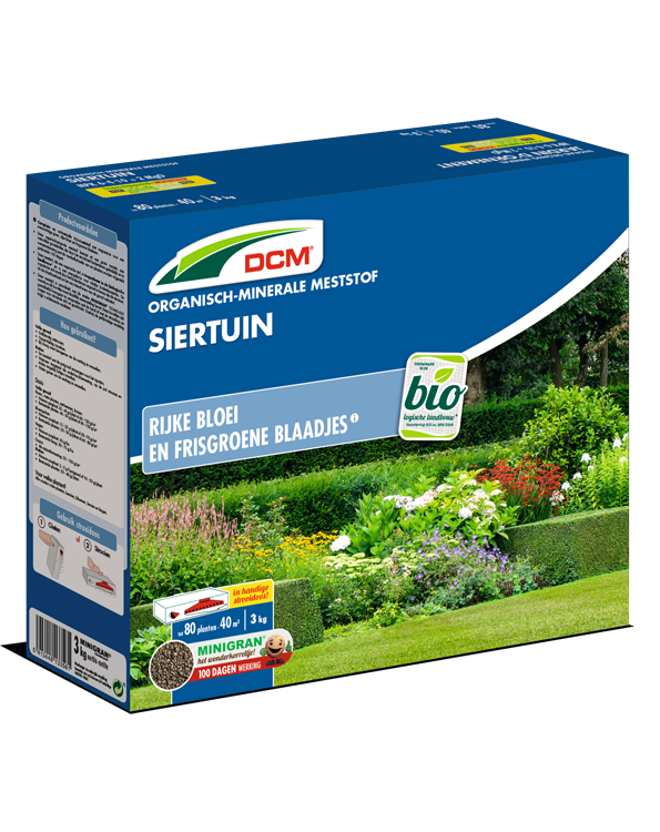 Groene verpakking van DCM Organisch-Minerale Meststof Siertuin, 3kg, met afbeelding van een bloeiende tuin.